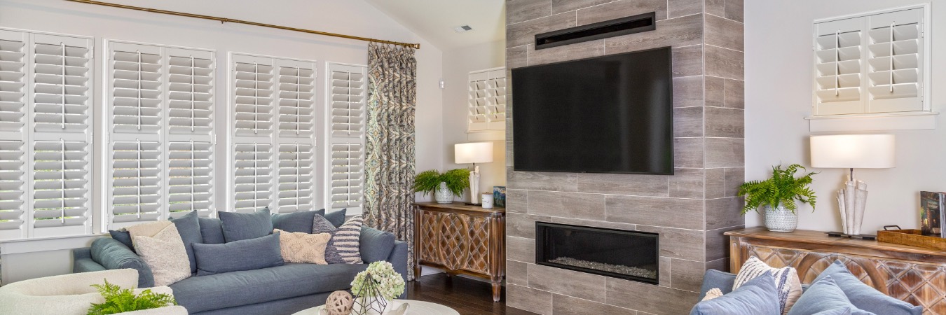 Interior shutters in Victoria living room with fireplace
