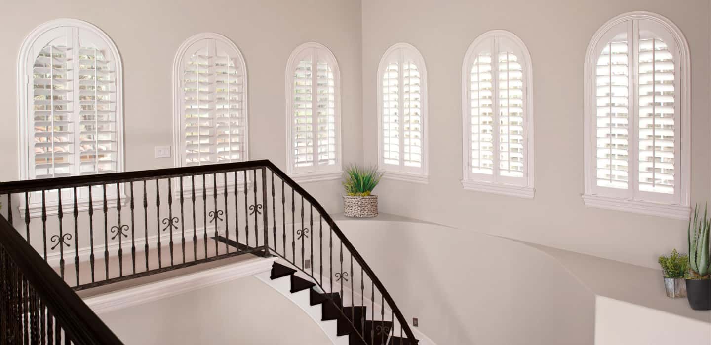 Custom-made window coverings cover your entire window and smoothly open and close. Arched Plantation Shutters