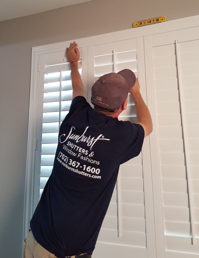 Shutter installation in Minneapolis bedroom.