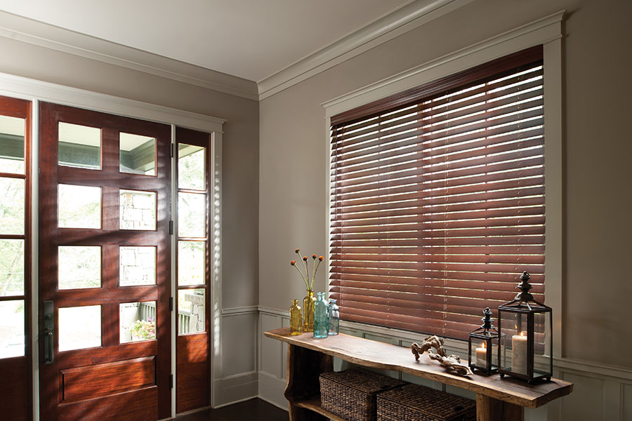 Wood blinds can be matched to your trim. Dark wood blinds in the front entryway