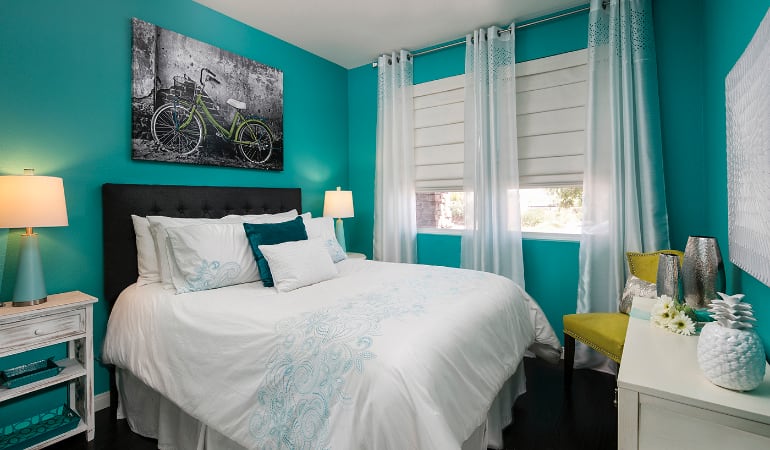 Photo Credit: Room Resolutions Roman shades in a Minneapolis bedroom