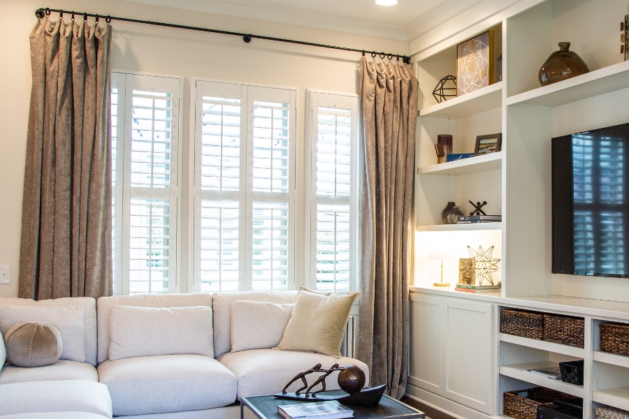 Install sun-resistant Polywood shutters in Minneapolis. Shutters in a living room