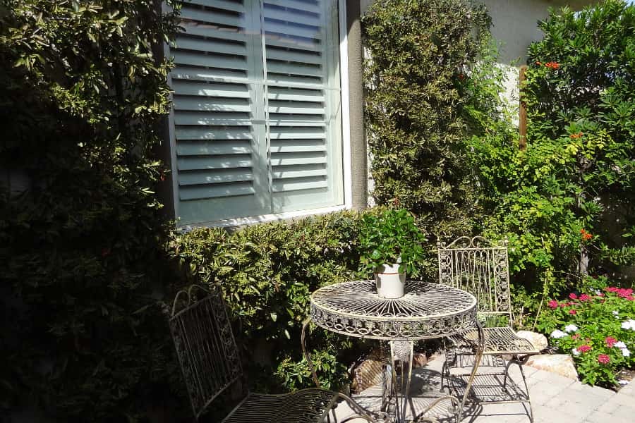 Photo Credit: Room Resolutions Polywood interior shutters display beauty and resilience to the outdoor weather.