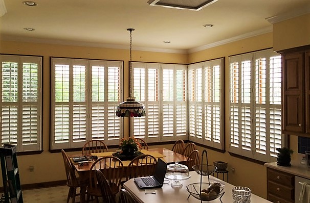 Polywood plantation shutters look great on oversized windows. Plantation shutters in kitchen