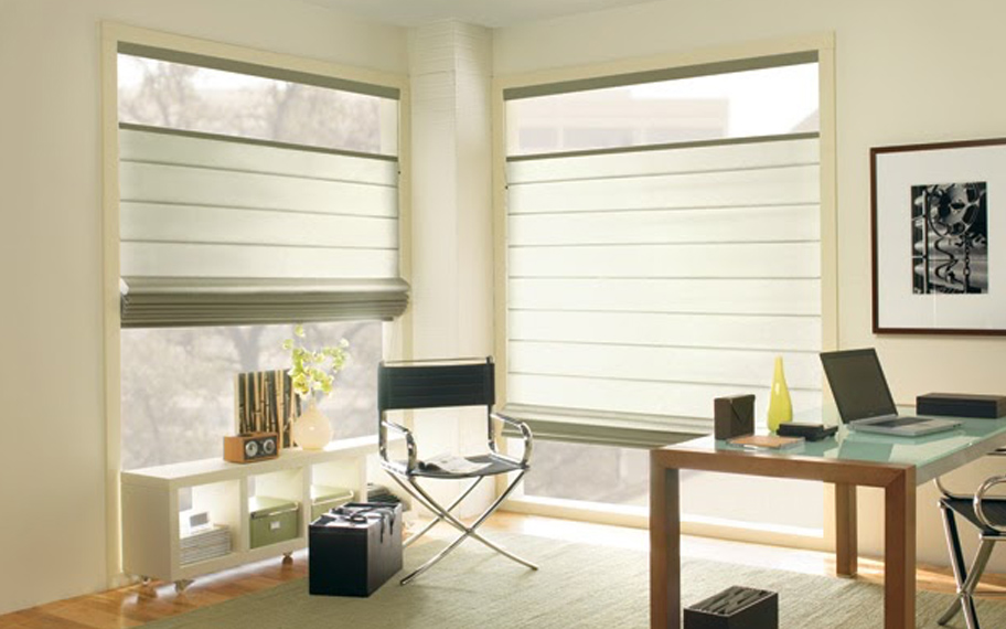 Upgrade your windows with stylish window shades or shutters in Minneapolis. Stylish sheer shades in the corner of a modern office.