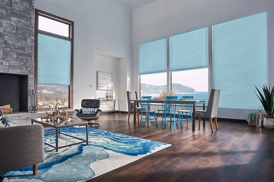 Smart motorized window shades are perfect on tall windows in your Minneapolis home. Blue motorized shades on tall living room windows